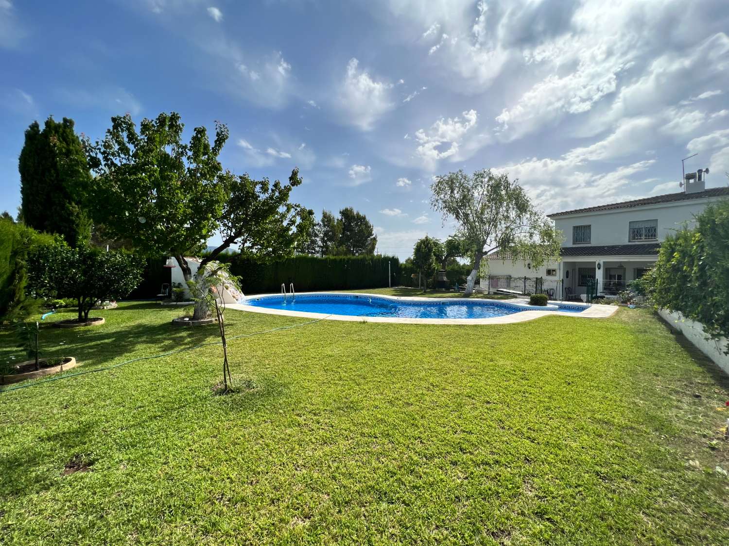 Semi-detached house with private garden and pool